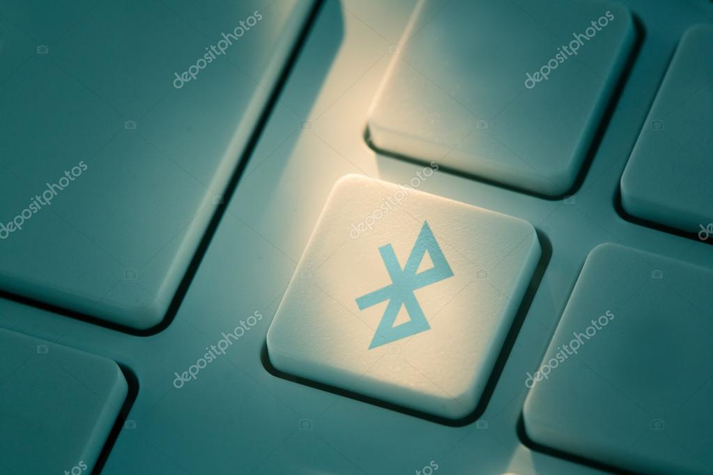 Blue bluetooth button on keyboard